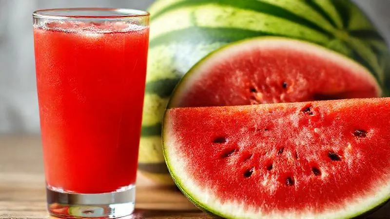 Photorealistic image of a glass of vibrant watermelon juice next to a whole, sliced watermelon, with a clear visual distinction between the two, emphasizing the pulp and fiber in the whole fruit. Cinematic lighting, sharp focus, depth of field, 8K hyper-detailed, professional photography, shot on a high-end DSLR.