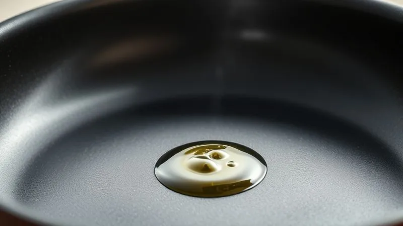 A close-up shot of a non-stick frying pan, glistening with a single, fine mist of olive oil spray. The pan is empty, ready for cooking, with soft, natural light highlighting its surface. Photorealistic, professional photography, 8K, cinematic lighting, sharp focus, depth of field, shot on a high-end DSLR.